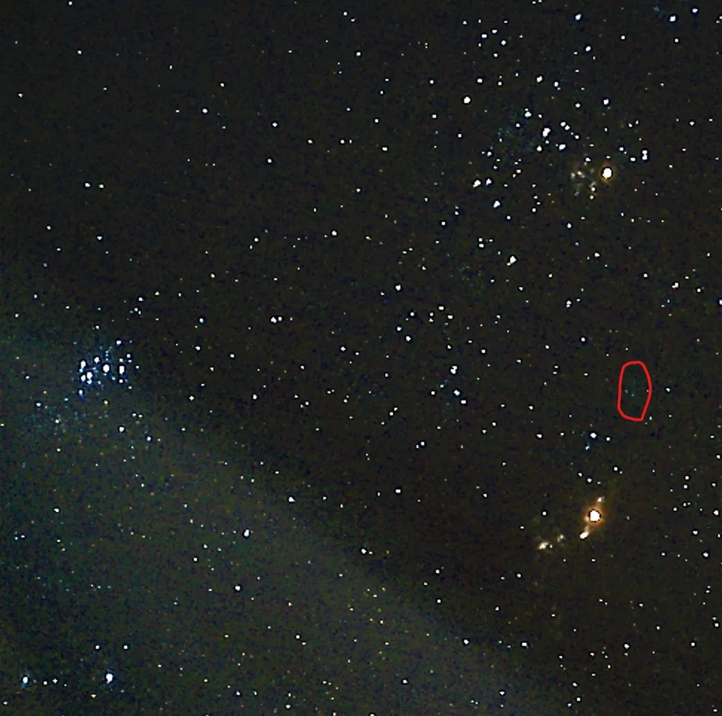 A starry image, featuring Mars, Pleiades and a tiny smudge that is the green comet.